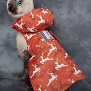 Red all seasons cat harness with a Christmas reindeer pattern. Shown with the hood and bum attachments.