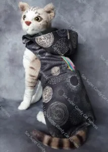 Black all seasons cat harness with a gold pattern. Shown with both the bum and hood attachments.