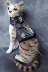 Black all seasons cat harness, with a gold pattern. Shown without the bum and hood attachments.